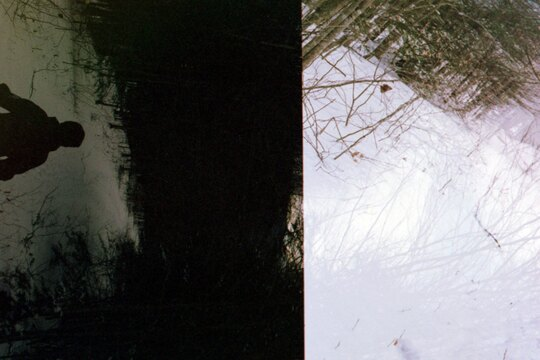 Split frame double exposure of a passing hiker in the winter.